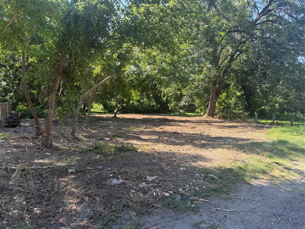 Build your dream home on this beautiful 0.265-acre residential lot nestled in the heart of Waxahachie. Surrounded by mature trees and natural landscaping, this homesite offers a peaceful setting with added privacy while providing an excellent canvas for a custom-built home. Located in an established neighborhood with convenient access to shopping, dining, schools, and major roadways, this property is ideal for homeowners, builders, or investors looking to take advantage of the area’s continued growth. Enjoy the charm of small-town living while remaining close to everyday conveniences. Utilities available nearby. Buyer to verify availability and connection requirements. Don’t miss this exceptional opportunity to own a prime residential homesite in one of Ellis County’s fastest-growing communities.