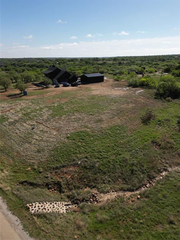 Discover this stunning vacant corner lot near Lake Cisco in the prestigious Hidden Shores development! Perfect spot to build your dream home or lake getaway!  Owners have full access to the gated, community boat ramp for easy access to Lake Cisco!  Lot is mostly level and cleared, ready for your new build!  Water and electric are supplied to each lot in the development.  Buyer will need to install a water meter and septic system.  Conveniently located just North of the small town of Cisco which offers restaurants, boutique shopping, wineries and a brewery.