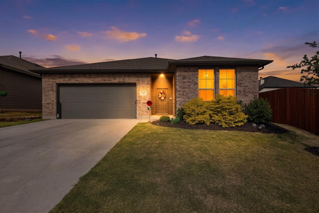 ***Ask how to get Up to 5 % towards closing cost or downpayment with preferred lender***

Built in 2023, this beautifully maintained home at 645 Pawprint Hollow offers modern style, thoughtful upgrades, and a backyard that truly stands out. The current owners have added several high-quality touches throughout the home, making it move-in ready from day one.
Enjoy a huge backyard perfect for entertaining, relaxing, or creating your dream outdoor space, complete with a covered patio featuring a newly added awning for year-round enjoyment. Inside, the kitchen shines with granite countertops, upgraded appliances, an upgraded sink, and modern finishes that make both cooking and hosting easy. The bathrooms feature elegant quartz countertops, while ceiling fans have been added to every room for extra comfort. Additional upgrades include gutters and stylish new lighting décor in the dining area that adds the perfect touch of character and warmth.
This home combines the benefits of newer construction with upgrades already completed for you — giving you comfort, style, and value all in one.