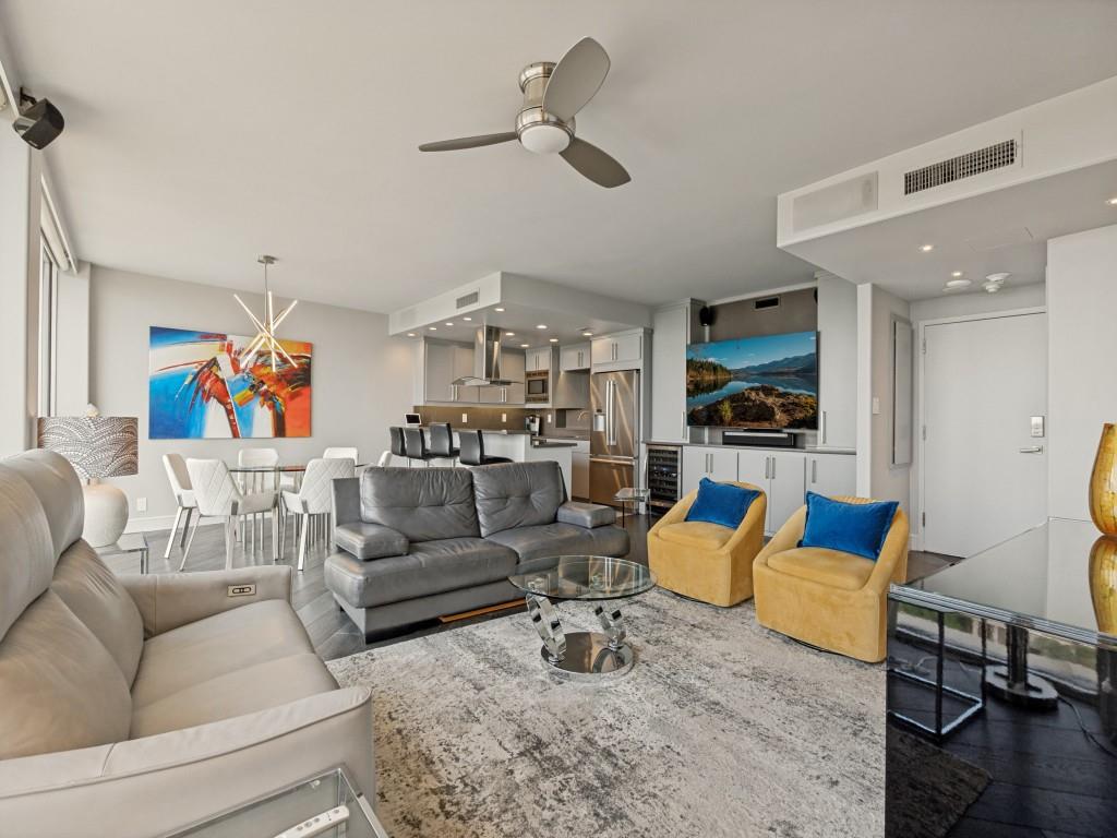 Sophisticated design and breathtaking downtown views define this stunning 17th-floor Preston Tower condo. Completely reimagined and updated featuring a spacious, open floor plan & impeccable finish detail. All windows and sliding doors replaced with floor-to-ceiling low-e, UV, double-paned glass, all with electric roller shades. The well-appointed kitchen has custom cabinets, Bosch appliances, quartz countertops with full-height backsplash, and under-cab LED lighting. Primary suite features built-in king-size bed frame, night tables, & dresser (can easily be removed), custom closet cabinetry, and a sleek modern bath. Second bedroom is currently used as an office with built-ins. Additional features include LED custom lighting throughout, ceiling-wall speakers, solid-core pocket doors, a 23’ tiled balcony, an LG washer-dryer, and wood floors. Preston Tower offers the ultimate lock & leave lifestyle with amenities that include 24-hour front desk and basement attendants, fitness center, community room with kitchen and library, pool courtyard with fire pit, tennis-pickleball court, and dog park. All utilities, internet-WIFI service, and HVAC maintenance are included in the monthly HOA dues. Various services are located on the building's 1st and 2nd floors, including a coffee shop and Bernie’s bar. Ideally located between the Park Cities and Preston Hollow, Preston Tower is within walking distance of Preston Center shops & restaurants and offers easy access to NorthPark, Preston Royal, US-75, and DNT.