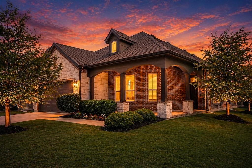 Welcome to the home that proves you don't have to choose between style and substance. Situated on a spacious corner lot, this impeccably maintained Windsor-built home combines designer-inspired finishes, thoughtful functionality, and major recent upgrades—including a brand-new Class 4 impact-resistant roof.

From the moment you arrive, the charming covered front porch and exceptional curb appeal set the stage for what's inside. Step through the front door to beautiful wood-look tile flooring and a flexible front living space that can easily serve as a home office, formal dining room, playroom, or second living area.

At the heart of the home, the gourmet kitchen is designed to impress with crisp white cabinetry, a gas cooktop, double ovens, and an oversized island perfect for gathering with family and friends. The open-concept layout flows effortlessly into the spacious living room, where a corner gas-log fireplace creates a warm and inviting focal point.

The split-bedroom floor plan offers privacy and functionality, while the primary suite serves as a relaxing retreat with spa-inspired finishes and a luxurious ensuite bath. Even the laundry room has been elevated with custom designer touches that make everyday living feel a little more special.

Step outside to enjoy the covered patio and beautifully maintained backyard—ideal for entertaining, relaxing, or simply enjoying Texas evenings.

Located near top-rated schools and outstanding neighborhood amenities, this move-in ready home offers the added financial benefit of NO MUD or PID taxes. Thoughtfully designed, meticulously cared for, and loaded with timeless appeal, this is a home you'll appreciate from the moment you walk through the door.