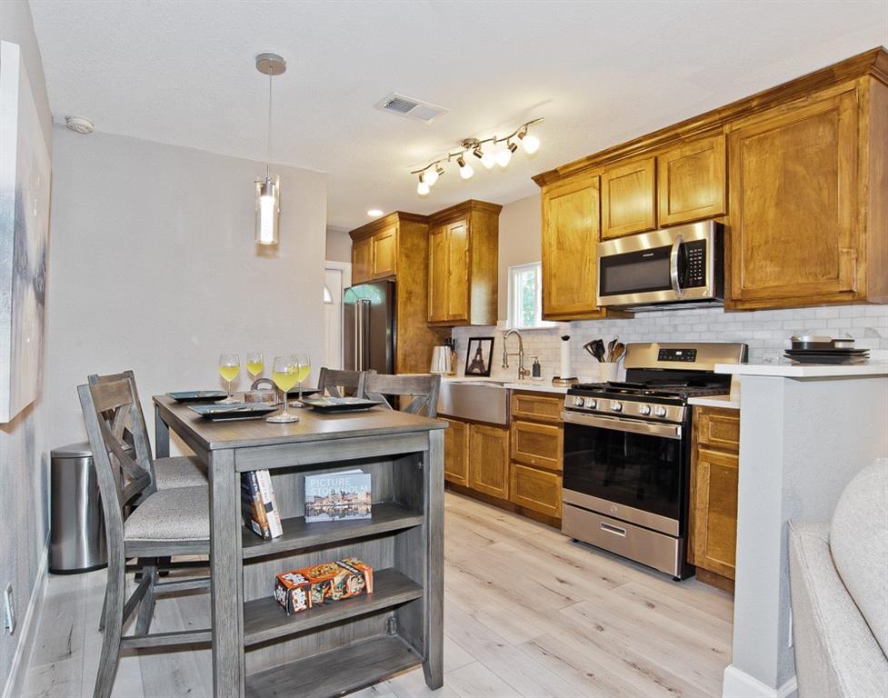 ATTENTION INVESTORS, this property is an established PROFITABLE AIRBNB!  Also, perfect for owner occupancy as well!  Completely remodeled with stunning custom onsite wood-stained cabinets, quartz countertops, stainless steel appliances, refrigerator included, 2-inch faux blinds, drapes, furniture conveys with all household items as well.  Water heater and AC replaced 5 years ago.  Just minutes from Trinity Groves, Downtown & Uptown Dallas, Love Field, Bishop Arts, Interstate 35E, I30, & the Southwestern Medical District!  Relax in this lovely 3 bed, 1 bath, luxury kitchen, 60-inch TV with firestick and large fenced backyard perfect for your fur babies.  Features one king, one queen & one full size bed and blazing fast fiber optic internet. Enjoy the open floor plan and onsite full size stackable washer & dryer.  Easily sleeps 6 guests and a couch for 7!  Perfect for families, friends or business travelers.   All information deemed reliable but not guaranteed.  Buyer of Buyer's agent to verify all information contained within the listing.