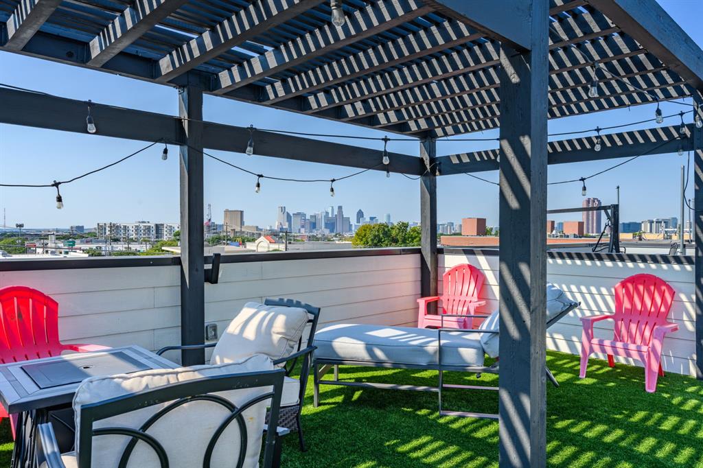 Price improved. No HOA. Live in the heart of Lower Greenville in one of Dallas' most stylish lock-and-leave townhomes. Three levels of thoughtfully designed living space, a private rooftop terrace with unobstructed Downtown Dallas skyline views, and a location that puts the city's best dining, coffee, and nightlife literally at your doorstep. The layout works as hard as the location. First floor delivers a private guest suite with ensuite bath, laundry, and an oversized two-car garage. The second level is built for living and entertaining, open-concept kitchen, dining, wet bar, and living room flow seamlessly onto a private balcony overlooking Greenville Avenue. The third level houses an ensuite secondary bedroom and primary suite with tall ceilings, generous walk-in closet, and a beautifully updated bath with double vanities and oversized walk-in shower. At the top, the pergola-covered rooftop terrace is the exclamation point ! skyline views, al fresco dining, and the kind of outdoor space that makes this home impossible to replicate at this price. Throughout: hand-scraped hardwood floors, abundant natural light, three ensuite bedroom suites with updated designer finishes, and quality craftsmanship that shows at every turn. Steps from HG Supply Co., La La Land Café, Truck Yard, and Trader Joe's. Walk to everything. Drive when you choose to. No HOA means no restrictions and a compelling rental investment opportunity for buyers who want flexibility. Turnkey opportunity available; ask about partial furnishings. $625,000. No HOA. Rooftop skyline views. Lower Greenville address. This one checks every box.