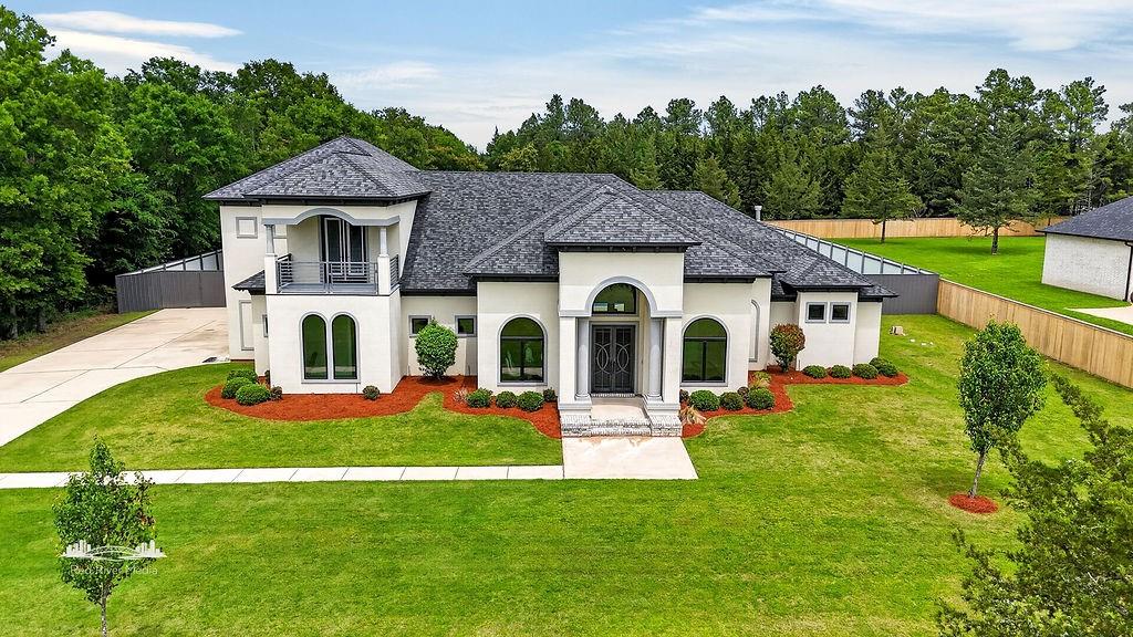 Tucked inside the prestigious gated community of The Point at Cross Lake, this exceptional Martin Signature Homes build blends luxury with the charm of lake living. Situated on just over an acre, this 3,570 sq ft home offers space to relax, entertain, and truly enjoy where you live. Inside, soaring ceilings, birch hardwood floors, and a light-filled open concept create an inviting atmosphere. The chef-inspired kitchen flows seamlessly into the main living and dining areas, perfect for gatherings. With 3 bedrooms, 3 full baths, and a half bath, comfort is found in every detail. A dedicated office with dual built-ins adds both style and function. Step outside to your private retreat with an inground pool and screened patio. Enjoy easy access to Cross Lake with the community boat house, perfect for boating, sunsets, and lasting memories.