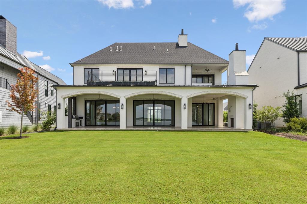 **GOLF COURSE AND LAKE VIEWS** Introducing an extraordinary custom lakefront home on Cedar Creek Lake, located in the prestigious gated community of Long Cove. This architectural gem is the only home in Long Cove built by luxury builder Sharif Munir Custom Homes, known for their impeccable craftsmanship and design. With seven spacious bedrooms, this home was built with hosting and comfort in mind. Two luxurious primary suites offer privacy and the ideal setup for multigenerational living. Three guest bedrooms are thoughtfully appointed, and two large bunk rooms are equipped with queen-sized beds, offering ample sleeping arrangements for extended family or weekend guests. An expansive game room and a dedicated office provide flexible spaces for work and play, while the open concept main living area offers stunning lake views and seamless flow to the outdoor living space. The arched design of the covered back patio not only adds architectural elegance but beautifully frames the lake, creating a picture perfect setting for relaxing evenings, outdoor dining, and quiet mornings with coffee in hand. Living in Long Cove means more than just a home, it’s a private lakefront lifestyle with exclusive amenities including pickleball, tennis, golf, three resort-style pools with grill and bar, miles of hike and bike trails, the Treehouse Adventure Park, and four stocked fishing ponds.  **EXCITING NEWS!  The newest addition to Long Cove is unders construction, The Old Mine Golf Club will be a premier course designed by Beau Welling, scheduled for completion in 2027.
This is a home where memories are made, stories are shared, and lake life is truly lived!!!