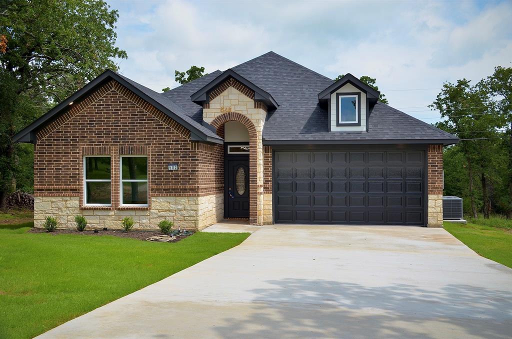 Welcome to your peaceful retreat in Runaway Bay! This is where modern comfort meets natural beauty. This brand-new build was meticulously designed with a seamless balance of elegant style and practical everyday living. Nestled among mature trees, your private backyard is a serene sanctuary for watching deer and other native wildlife. Step inside to a bright, open-concept floor plan centered around a stunning fireplace. 

The chef-inspired kitchen features premium countertops, a large island, custom cabinetry, stainless steel appliances, and a stylish coffee bar. Perfect as a luxury retreat, weekend getaway, or peaceful escape with the ideal blend of comfort and outdoor living.

Features You’ll Love: 
Chef’s Kitchen: Quartz countertops, large island, custom cabinetry, stainless steel appliances, modern lighting, and a dedicated coffee bar.
Luxurious Living Room: Bright, spacious open-concept floor plan featuring a stunning fireplace and space to relax.
Primary Suite Retreat: Spa-like bathroom with dual vanities, a dual walk-in shower, and an oversized walk-in closet.
Outdoor Living: Covered front porch overlooking mature trees, private nature views, and abundant local wildlife.

Why Choose This Home? 
Energy-Efficient: Central heating and air conditioning paired with modern LED lighting and energy-saving appliances.
Engineered Piered Foundation: This home features a reinforced slab supported by 34 structural piers, providing exceptional stability, durability, and long-term peace of mind.
Prime Location: Minutes from Lake Bridgeport boating, fishing, and golf courses, all within an hour of Fort Worth.
No HOA Fees: Enjoy ultimate flexibility and total freedom to use your property however you like.
2-10 Home Buyers Warranty at closing