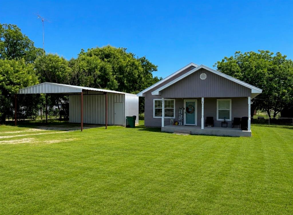Step into this charming 3-bedroom, 2-bathroom home nestled on just under half an acre — a cozy retreat with plenty of room to breathe. Inside, you’ll find a welcoming blend of laminate and natural flooring that adds character and comfort throughout the living spaces.

The fully fenced backyard offers privacy and peace of mind, while the covered porches create the perfect setting for relaxing evenings or hosting guests. For those who need extra space to work or store tools, there’s a 21' x 10' sized shop or storage shed conveniently attached to the two-car carport, adding both function and flexibility to the property.

This home delivers a wonderful balance of charm, practicality, and outdoor enjoyment — a great fit for anyone looking for a place that feels just right.