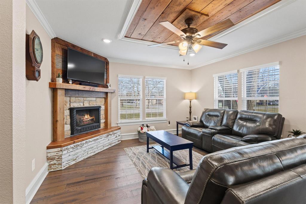 Fall in love with this beautifully reimagined Craftsman gem & 24x30 ultimate workshop or storage solution with its own private driveway. Tasteful modern upgrades seamlessly blend with the authentic character & architectural charm of its century-long history. The curb appeal is unforgettably inviting, the interior just as charming. The bright & sunny entry foyer offers the perfect spot to pause, featuring a sweet seating nook & storage for a clutter-free welcome. Authentic, original to the home wood shiplap is featured as architectural art throughout, perfectly blending historic charm with modern, curated style. Highlights include a spacious living room with a gas log fireplace & versatile dining areas. Host dinner parties with ease in the rustic, elegant dining room, which opens into a bright, chef’s kitchen with breakfast bar seating. Gorgeous cabinetry, granite counters, center island & pantry, with space to entertain. The spacious primary suite is a true sanctuary, offering a peaceful atmosphere for rest & relaxation. Main bath features beautiful cabinetry, granite counters, & dual vanities. Includes stunning shower, tub, & built-in linen closet for ultimate organization. The additional bedroom & half bath add function & flexibility to this charmer. Fully fenced, expansive backyard with multiple entertainment zones! Recently added above-ground pool with safety fencing, surrounding patio & plenty of room for grilling & lounging. The workshop is fully enclosed with premium spray foam insulation, brightened by modern LED lighting & versatile loft area for extra storage. Featuring two convenient roll-up doors, electricity & dual overhangs for covered outdoor storage, this shop is perfect for projects, ATVs or covered parking. Beautiful neighborhood, excellent location, in high performing Leonard ISD. Close to shopping, restaurants, convenient to McKinney, Bonham, Sherman & Greenville.