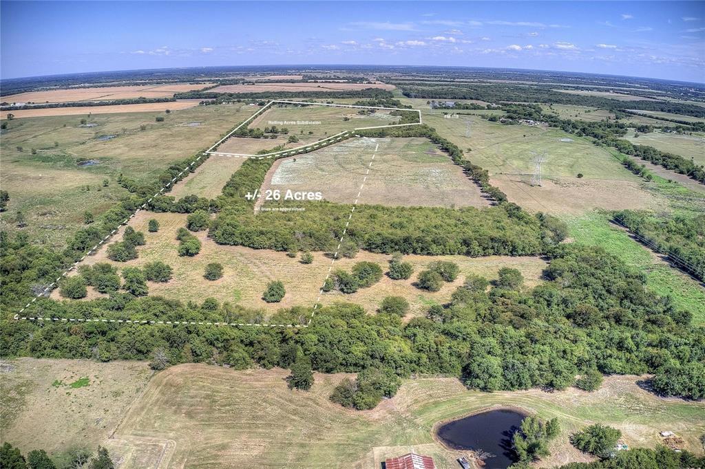 Located just north of Greenville and approximately five miles east of I-30, this ±26-acre tract offers a versatile opportunity for buyers looking to build, invest, or enjoy more space in a growing area of Hunt County.

Surrounded by established 1+ acre homesites, the property sits within an active rural residential area, making it well-suited for custom homes, barndominiums, manufactured homes, or small-scale development.

Access is provided by Rolling Lane, a paved county-maintained road, with Shady Grove water and underground electric available at the property line—helping reduce upfront costs and simplify the building process.

The land features level topography with a mix of open pasture and scattered trees, allowing flexibility in layout and use, whether for a private homesite, multiple residences, or recreational use.

Located outside city limits with no HOA, this property offers the freedom to build and use the land without many of the restrictions found in traditional neighborhoods.

With continued growth expanding from Greenville and convenient access to I-30, this tract presents a strong opportunity for both immediate use and long-term potential.
