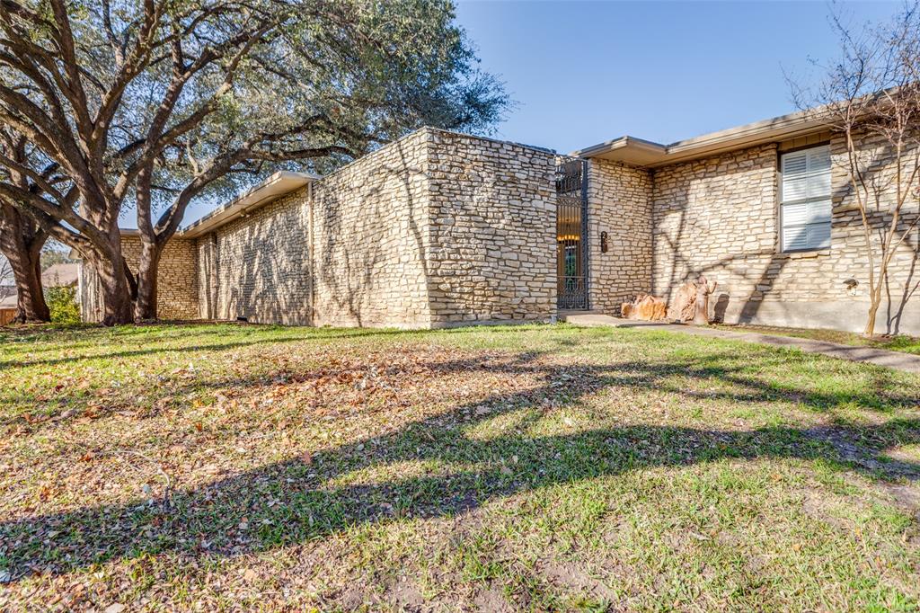 Stunning Mid-Century Modern Architecture designed by renowned architect John Wesley Jones.  ***THE HOA DUES INCLUDE SO MUCH INCLUDING WATER, TRASH, GROUNDS MAINTENANCE, THE POOL AND MORE.***  This one is Freshly updated with Paint and Flooring.  You won't believe the Abundance of Closets.  Enjoy your Private Rock Enclosed Courtyard with its Iron Gate. The Custom Kitchen Cabinets offer several Special Features.  This home offers Two Master Suites, each with its own Private Bath.  A Third Bath is off of the hallway and has a Full Shower. The Second Living Area is a very Flexible Space.  Other Homes in the Community use that space as an Additional Bedroom, a Dining Room or a Study.