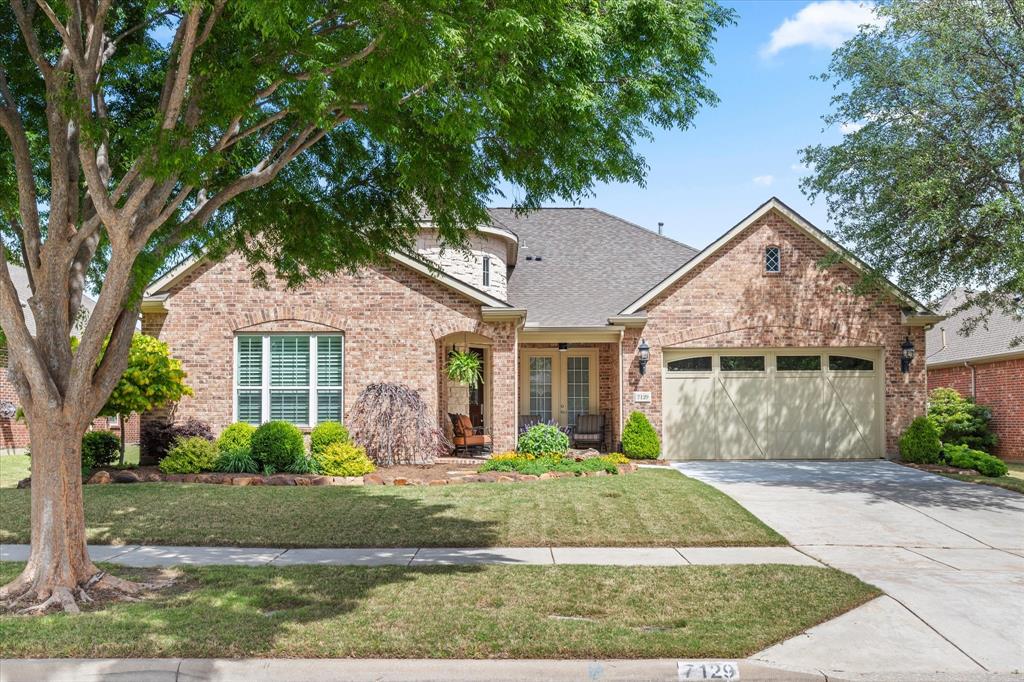 This beautifully maintained home, boasting over $100K in upgrades, is ideally situated on a quiet cul-de-sac street and features the Balboa floorplan—one of the largest in Frisco Lakes with over 2,700 square feet. Offering 3 bedrooms, 3 full bathrooms, a private study or second living area, and a spacious formal dining room, this home is designed with both entertaining and everyday comfort in mind. The open-concept great room seamlessly connects the family room, extended sunroom, kitchen, & breakfast nook, creating a warm and inviting space. At the front of the home, a generously sized guest bedroom overlooks the front yard and is paired with a full bathroom, while the study is enclosed with elegant glass French doors for added privacy. The formal dining room easily accommodates large gatherings and is conveniently located near the kitchen, which features extensive granite countertops with bar seating, a new GE Profile 5-burner gas cooktop with upgraded vent, double ovens, microwave, built-in refrigerator, and a walk-in pantry. The family room includes a fireplace—a rare feature—along with a sunroom sitting area & sliding doors that lead to the backyard. The private primary suite is tucked away at the rear of the home with a cozy sitting area & a luxurious bath complete with dual vanities, soaking tub, walk-in shower, and a customized walk-in closet. A 3rd bedroom & full bath are located in a separate wing, ideal for guests. Additional highlights include a large laundry room with sink and a three-car tandem garage with space for a golf cart or workshop. The beautifully landscaped backyard offers exceptional privacy with a living fence of Magnolias and Holly trees and a pergola-covered patio perfect for relaxing or entertaining. Located in the vibrant 55+ Frisco Lakes community, residents enjoy access to over 40,000 square feet of resort-style amenities including fitness centers, pools, tennis, pickleball, bocce courts, walking trails, and numerous social activities.