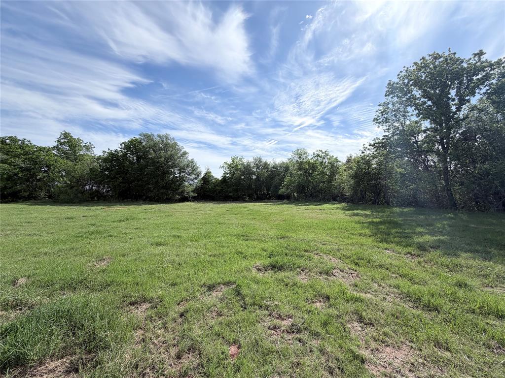 This 1-acre lot within the city limits of Whitney is mostly open with a backdrop of large mature trees, offering privacy and natural beauty. Located in the gated Lakewood Acres subdivision with City water, underground electric, and a chip sealed private road. Deed restrictions align with City of Whitney rules. A peaceful homesite close to town with abundant wildlife.