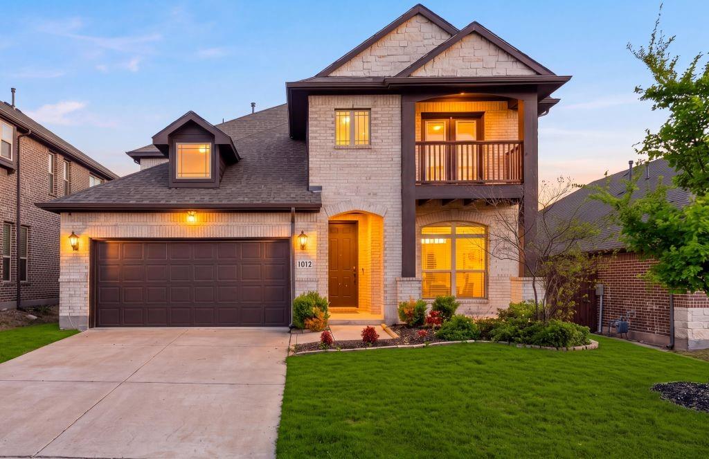 Built in 2020, this 3,305 square foot Willow Wood home features two primary suites, one on each level, within a 5 bedroom, 3 full bath and 1 half bath layout. The first floor primary suite has an ensuite bath with dual sinks, a garden tub, separate walk in shower and walk in closet. The second floor primary suite provides an ensuite bath with dual sinks, an extended walk in shower and walk in closet. Upstairs are three additional bedrooms with closets, a third full bath with dual sinks and a tub and shower combination, plus a loft opening to a covered balcony. The open concept main level has vaulted ceilings, multiple windows, custom blinds and a kitchen featuring granite countertops, a large island, walk in pantry and stainless steel refrigerator that conveys. The extended covered patio is equipped with a ceiling fan, ceiling electrical outlet for string lights and gas connection for a grill. The fenced backyard has a retaining wall, with the rear neighboring property positioned at a lower elevation. The home also has two HVAC systems, one serving each floor, two water heaters, full rain gutters, a sprinkler system, multiple exterior hose connections, smart home features and a Lorex camera system that conveys. Community amenities consist of a pool, playground, sidewalks, park areas and trails.