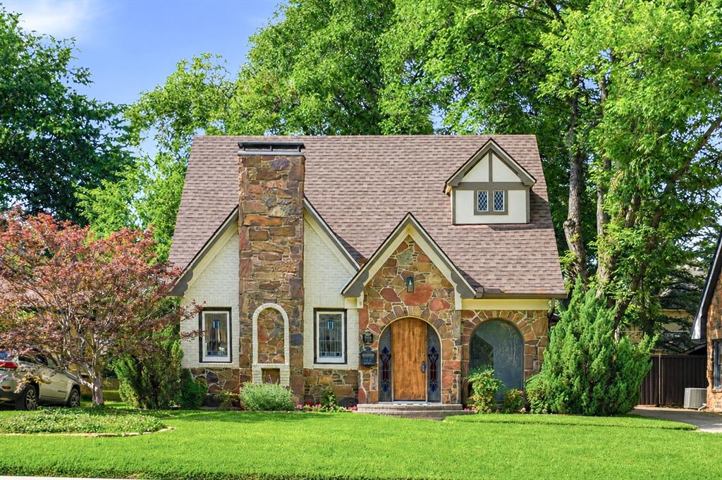 Nestled on a charming, tree-lined street in the heart of the M Streets, this timeless home seamlessly blends historic character with the spaciousness and updates desired for modern living. Original architectural details create a warm, inviting space throughout the thoughtfully laid out home. The kitchen serves as the heart of the home, featuring quartz countertops, stainless steel appliances, and a breakfast nook perfect for casual dining. The living spaces provide flexibility for both everyday living and entertaining, including a formal dining room and a welcoming living room anchored by a gas fireplace. The downstairs primary suite offers a private retreat with a renovated ensuite bath featuring a soaking tub, separate shower, dual vanities, and a walk-in closet. Upstairs, two generously sized bedrooms are complemented by a full bathroom, providing comfortable accommodations for family and guests. Recent improvements completed since 2020 include a renovated kitchen, remodeled primary suite, newer water heater, and a new HVAC system.  Outside, a spacious backyard with a stone patio provides ample room for entertaining, play, or gardening. A detached two-car garage with additional storage adds everyday convenience. Zoned to Mockingbird Elementary and just moments from the shops, restaurants, and neighborhood favorites of East Dallas, this special home offers the perfect balance of historic character, modern updates, and exceptional livability.