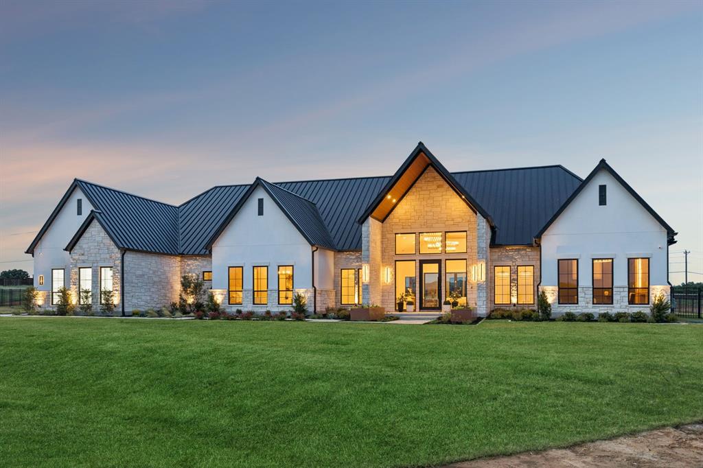 WOW! Introducing 1101 Pitner Court — a newly constructed masterpiece set on 2.161 private acres in Bartonville's distinguished Eagle Ridge Estates. Spanning 7,397 square feet with 7 bedrooms, 6 full and 1 half baths, and three expansive living areas, this single-level estate was designed for those who demand the extraordinary. Step inside to soaring vaulted ceilings with architectural beams, European white oak floors, Taj Mahal quartzite surfaces, and designer statement chandeliers that set a tone of refined grandeur throughout. The chef's kitchen stuns with a 48 in Wolf professional range, Sub-Zero built-in refrigerator and refrigerator drawers, Wolf espresso machine, butler's pantry, and a dedicated prep kitchen. A fully enclosed climate-controlled wine cellar and tasting lounge offers a world-class space for entertaining and curated hospitality. The spa-inspired primary suite offers a custom steam shower and a boutique walk-in closet with center island. A private two-bedroom guest casita provides elegant accommodations for extended family or guests. Outside, a resort-style pool and spa, full outdoor kitchen, fire pit, and custom Texas putting green create an entertainer's paradise. This home can accomodate 8-cars with a 4 car garage and an automotive pavilion featuringepoxy flooring, honey comb lighting, and two Tesla charging stations. Zoned to Argyle ISD. Luxury lifestyle at its finest - this is the one you have been waiting for!