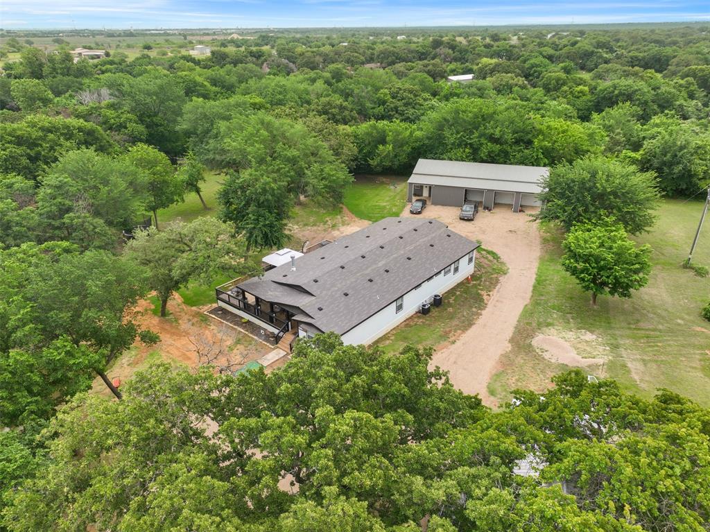 Beautiful Alvarado property featuring a spacious home, large trees, usable acreage, and an impressive large shop with mother in law suit, apartment and endless potential. This versatile property offers the perfect blend of country living and functionality with plenty of room for equipment, hobbies, business use, animals, or additional storage. Conveniently located with easy access to Hwy 67 and I-35W while still providing privacy and open space. Ideal for those looking for a peaceful Texas lifestyle just outside the city.