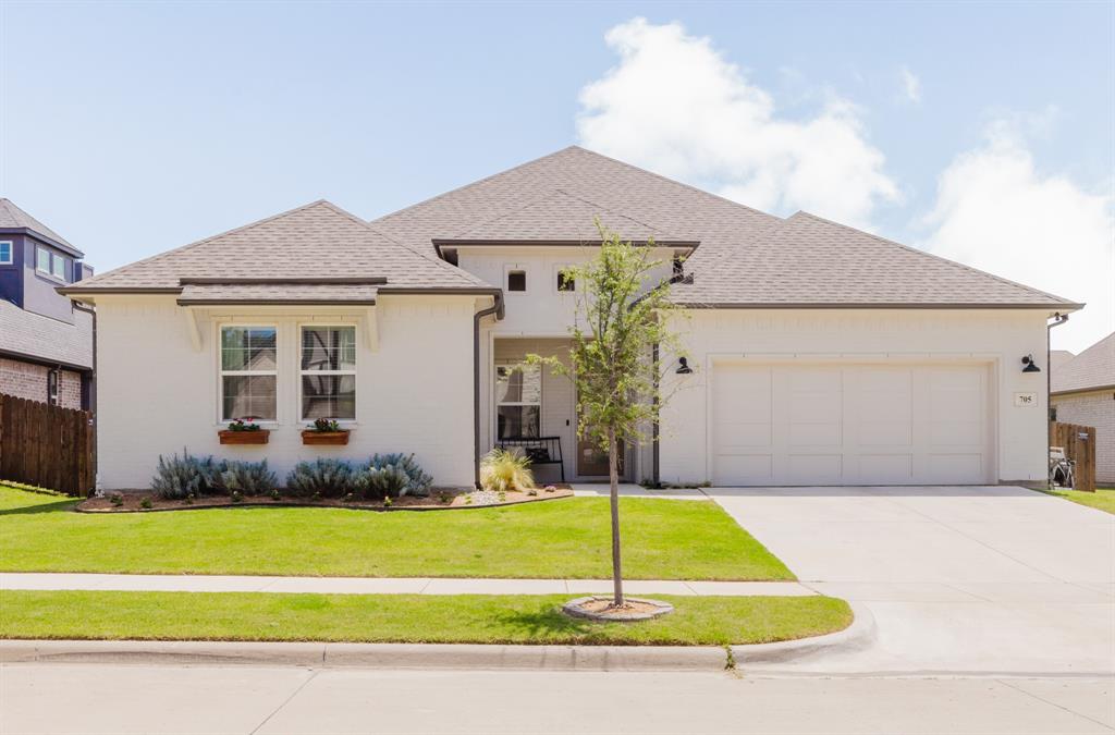 Welcome to this stunning single-story home with multiple upgrades in an incredible location. Wrapped in a complete brick exterior — zero siding — this residence offers the kind of low-maintenance curb appeal and structural integrity that buyers search for. Inside, an open and functional split floorplan creates the perfect balance of privacy and togetherness.

The heart of the home is a kitchen featuring floor to ceiling cabinets, gleaming quartz countertops, enormous island, and walk-in pantry. The propane range means consistent, precise cooking every time. Every bedroom includes its own walk-in closet, and the thoughtful Jack and Jill bath configuration makes the floorplan as practical as it is beautiful. The living room boasts a propane fireplace that works at the flip of a switch (even when the power goes out) and flanked by beautiful custom built-ins that add character while maximizing storage. Engineered hardwood flows throughout, and custom blinds are already in place — just move in and enjoy. The home is wired for ethernet throughout for the available fiber internet options. The extra large laundry room has been outfitted with cabinets, a drying rack, and a dedicated folding counter.

Step outside to an extended patio overlooking a yard maintained with ease thanks to the built-in irrigation system. Park in the oversized garage with room for two full size vehicles, a golf cart, lawnmower, and room to spare. Top it all off with access to a community pool, fitness center, and clubhouse plus the convenience of being within walking distance of dining, shops, and live music. This is the full package.