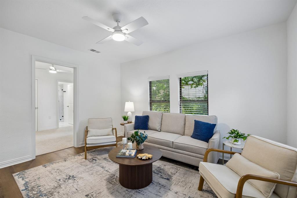 Welcome to 806 N Rudell St in Denton! This beautifully updated home blends modern finishes with cozy charm. Step inside to discover bright, inviting living spaces filled with natural light, fresh neutral tones, and stylish updates throughout. The remodeled kitchen features crisp white cabinetry, sleek countertops, stainless steel appliances, open shelving, and designer-inspired touches perfect for everyday living and entertaining. The renovated bathroom showcases a spa-like walk-in shower with elegant tilework and contemporary fixtures. Upstairs, the spacious loft offers endless flexibility for a second living area, home office, playroom, or guest retreat. Outside, enjoy a large backyard shaded by mature trees with plenty of room for entertaining, gardening, pets, or future possibilities. Conveniently located near downtown Denton, UNT, TWU, shopping, dining, and major highways, this move-in-ready home combines comfort, style, and location in one exceptional package!