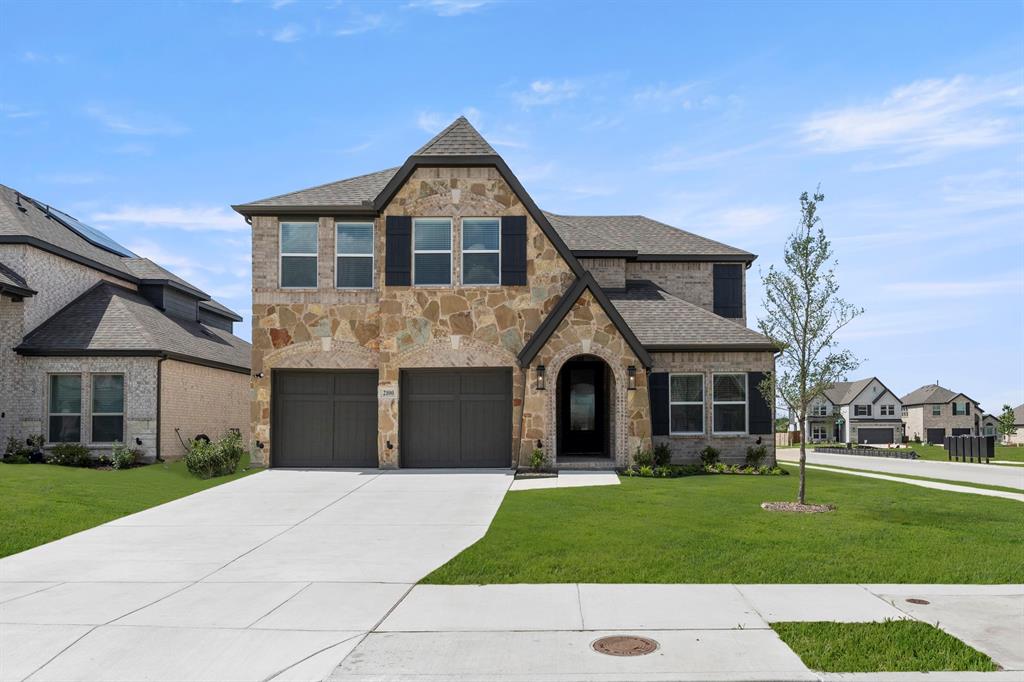 MLS# 21278054 - Built by First Texas Homes - Ready Now! ~ Discover this stunning 5-bedroom, 3.5-bath home on a desirable south-facing corner lot. With 3,209 sq ft of thoughtfully designed living space, this residence features a spacious open floor plan, upgraded LVP flooring downstairs, and plush upgraded carpet throughout. The custom kitchen boasts a wood hood and premium vent, perfect for culinary enthusiasts. Enjoy the luxury of a frameless prime bath shower and a convenient shower in the powder room. A two-car garage completes this exceptional home. Schedule your tour today!