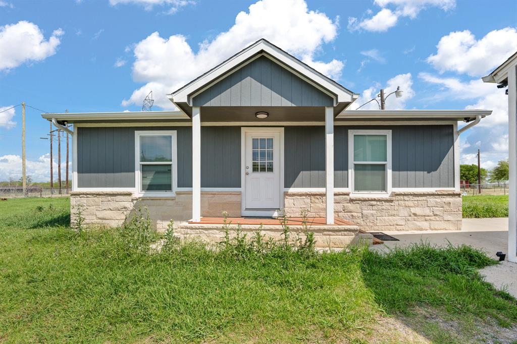 Welcome to this adorable 2025-built 2-bedroom, 2-bath home perfectly situated on just under an acre of fenced land. Step inside to an inviting open-concept layout featuring luxury vinyl plank flooring throughout, recessed lighting, and efficient mini-split systems in every room for year-round comfort. The kitchen is a standout with granite countertops, a stylish tiled backsplash, and a functional island ideal for gathering and entertaining. The spacious primary suite offers a private en-suite bath and walk-in closet for added convenience. Outside, you’ll find plenty of room to spread out with a detached 20x24 garage with an 8' door and an impressive 38x24 shop with double 8' doors—perfect for hobbies, storage, or workspace needs. This .95-acre property blends modern living with peaceful outdoor space, making it the perfect place to call home.