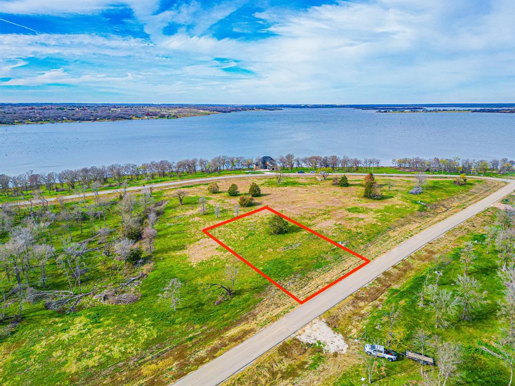 Come be a part of this exclusive new subdivision called Diamond Point. This beautiful peninsula located on Richland Chambers Lake which is  the 3rd largest lake in Texas. The gated community has a hill country feel with winding roads, heavily treed lots and breathtaking views.  Best of all, Diamond Point is located just over an hour from Dallas, making it a great option for a weekend get away, or full time residence. The roads are paved and utilities are underground. This lot is one of the most desirable water view lots and is located at the top of a peak next to the point. Have a boat, no problem, there is also a boat slip available for purchase.  You can go for a short ride to the marina to meet friends for drinks or a meal. Diamond Point is located in the highly acclaimed Mildred Schools district, and located 20 minutes from Downtown Corsicana, home to Collins Street Bakery, HEB Grocery, Starbucks and Chick-fil-A. The downtown area is so adorable with fun shops and restaurants.