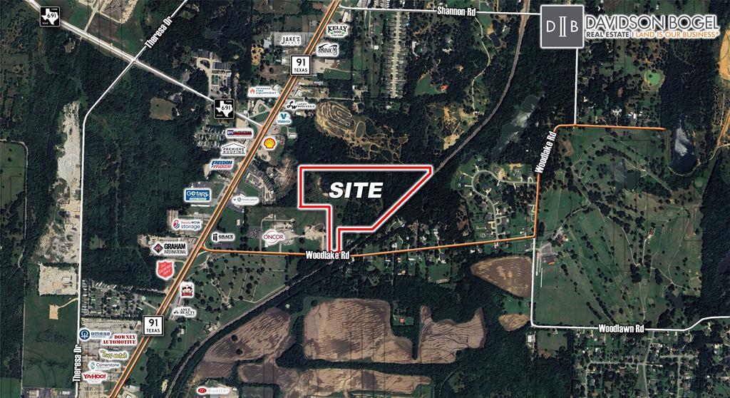 This +- 31.77 Acre property is situated in Denison's ETJ with roughly 1,000 ft of railroad frontage. The main point of access is along Woodlake Rd, with a previous access agreement in place along Texoma Pkwy. Water and Sewer are not on site, however, there are water lines nearby that can be pulled. Exhibits including topo and utility lines are included.