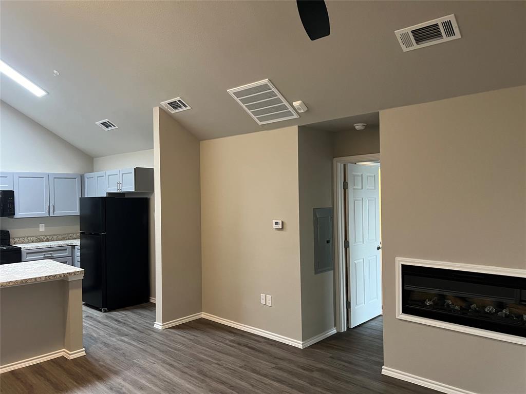 REDUCED! You will love this cozy 2 BR condo.  It's brand-new in a newly constructed building that has just been completed.  This lovely open floor plan is tastefully done with beautiful luxury vinyl flooring, bright with natural light, and soft grey hues just waiting for your decorative touch. Open Kitchen with light grey shaker cabinets, all new appliances including refrigerator.  Faux wood blinds throughout, and energy-efficient ceiling fans with remotes. Energy-efficient ceiling fans with remotes, and windows for natural light.  The electric fireplace provides an added level of comfort. Assigned parking, pool, tennis court, and SoPac trail for biking, jogging, or walking. Conveniently located minutes to shopping, Central Expressway, North Park, Central Market, Fine dining, and entertainment. Buyer or Buyer's agent should verify all measurements.
