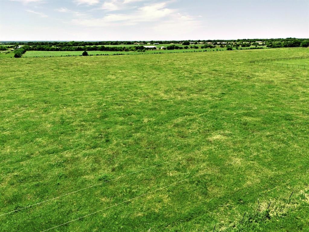 Beautiful 5 acre tract in Nevada Texas is ready for your dream home. Located outside city limits, this property offers the freedom of no HOA and fewer restrictions. Water and electricity are available at the road, making it convenient for future development. The land features a mix of wide open spaces with a few scattered trees, providing a peaceful setting with plenty of room to build, garden, and enjoy country living. A great opportunity to own acreage while still close to the conveniences of the city.