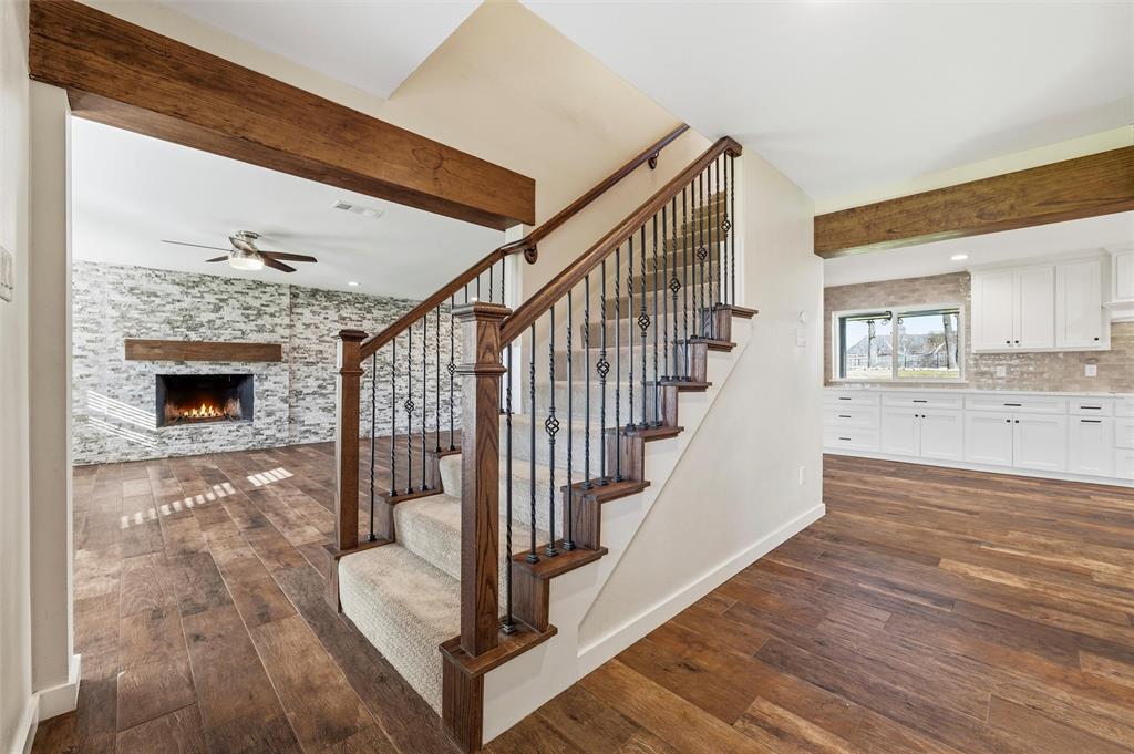 $5000 allowance availalble  Beautiful one-acre home in North Keller is now available! This truly one-of-a-kind property features recent renovations and thoughtful upgrades, including a spacious first-floor primary suite with an oversized closet and a serene, spa-like bathroom. The welcoming entry showcases warm wood-look tile flooring and opens to a large living and dining area centered around a natural wood-burning fireplace—perfect for gatherings and cozy evenings. The kitchen is a chef’s dream, offering stainless steel appliances, double ovens, a built-in convection microwave, smart vent hood, and an induction cooktop. Upstairs, you’ll find three generously sized bedrooms and two full bathrooms. The largest bedroom offers incredible flexibility and could easily serve as a game room or media room. Step outside and enjoy endless possibilities with plenty of space for kids to play, gardening, a future pool, or any outdoor activities you can imagine. The heated and cooled outdoor workshop is a rare and valuable bonus—ideal for North Texas living.
This exceptional home has it all. Come see it today!
