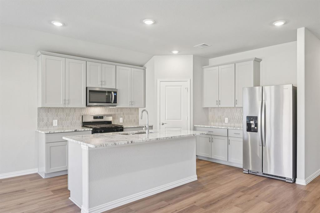 BRAND NEW energy - efficient home Jul 2026! The spacious living area flows seamlessly outdoors to the covered back patio. Pebble cabinets with marble-look white granite countertops, beige tone EVP flooring and multi-tone grey carpet. Lakehaven is a master-planned community located at the edge of Lavon Lake, featuring all of the modern amenities. Family time will turn into lake time during the warm Texas summers. The Spring Series will boast six floorplans from our National Park Collection that range in size from approximately 1,270 sq. ft. to 2,255 sq. ft. Each of our homes is built with innovative, energy-efficient features designed to help you enjoy more savings, better health, real comfort and peace of mind.