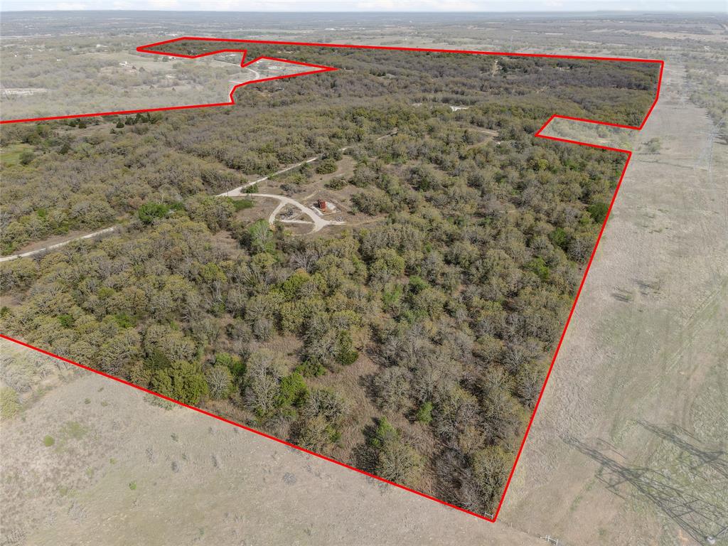Situated beyond the city limits, this sprawling 198 acre tract boasts an abundance of desirable features, making it an ideal canvas for a variety of development opportunities.  With ample road frontage, scattered trees and numerous picturesque home sites, this property is ready to be transformed into the next sought after community.