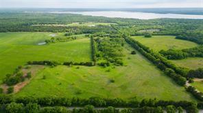Ready for Lake Life? It's ready for you, here at Lake Texoma! This land offers the best of everything to get you started on building a dream home with wide open spaces. Clean, level land with electric available, and the best part is accessible road frontage on Flowing Wells. Retreat into beautiful greenery and trees. Full time living or weekend retreat this is the place to be. All re plat is complete and Deed restriction will be finalized with minimum square footage and few restrictions. Flowing Wells Marina is exactly 1 mile away along with groceries, shopping and schools nearby. Corp property is adjacent and close to Hagerman Preserve. No mobiles allowed. Inquire about Builder referral or bring your own builder. Two additional lots are also available.