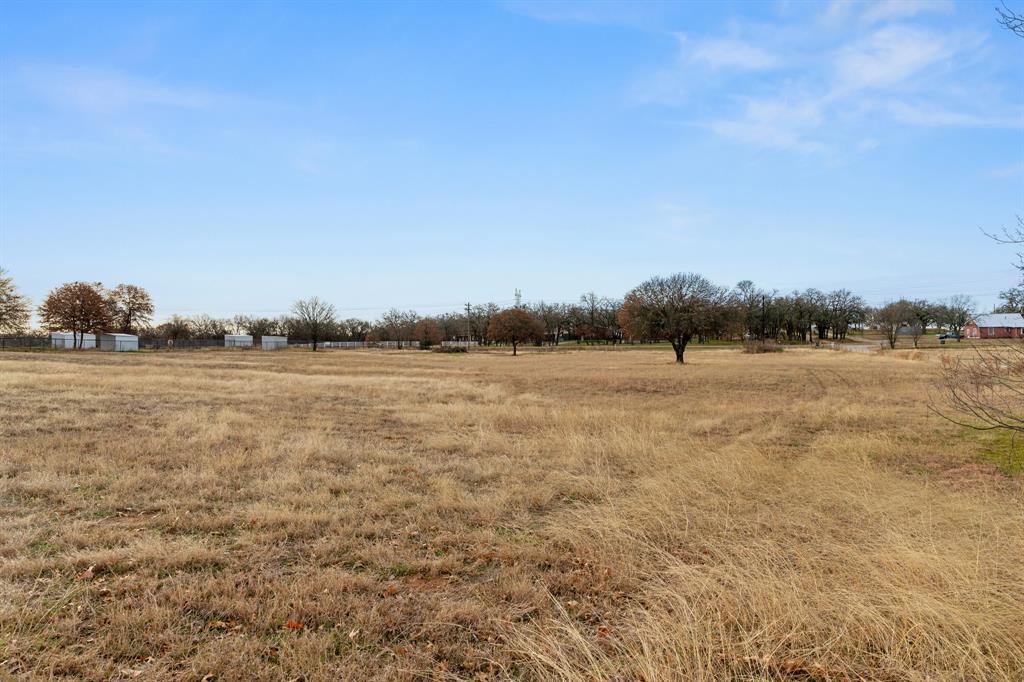 Discover the perfect place to build your dream home on this beautiful 3.5-acre tract offering 335 feet of road frontage and wide-open space to create your own private retreat. With water and electricity available at the road, this flat, open canvas is ready for your vision to come to life. Located outside city limits, you’ll enjoy the freedom and flexibility to bring your own builder and design the homestead you’ve always imagined — whether that’s a custom home, workshop, garden, or space for animals.