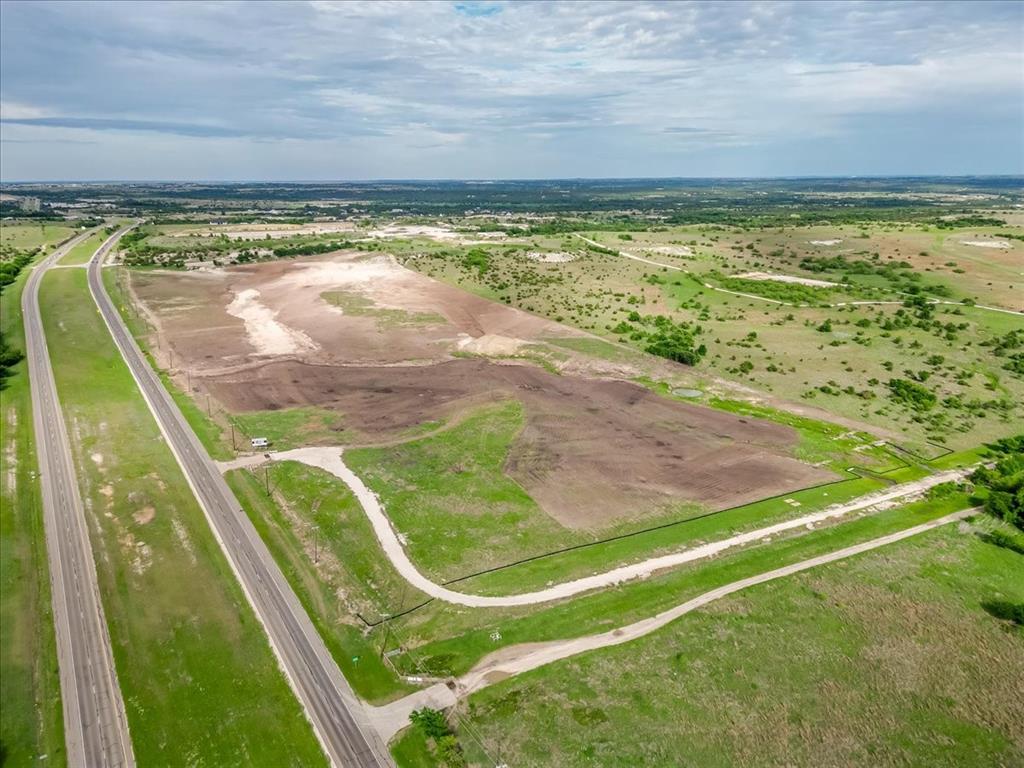 Introducing a premier commercial development opportunity in Cresson, Texas. This offering consists of seven newly available lots ideally positioned for business growth and long-term investment. Strategically located just minutes from Granbury, these parcels benefit from placement within one of the region’s most business-friendly communities. The area has experienced significant commercial expansion, driven in part by increased traffic flow along Highway 377 following completion of the loop that bypasses Cresson’s well-known railroad crossing. The lots range in size from approximately 5.023 acres to 12.067 acres, providing flexibility for a variety of commercial development concepts. Five of the seven lots feature direct frontage along Highway 377, offering exceptional visibility and accessibility for a wide range of uses. Utilities, including electric and fiber connectivity, are readily available, supporting modern business infrastructure needs. This is a rare opportunity to establish a presence in a rapidly growing corridor with strong traffic counts and continued development momentum. Developer will subdivide.