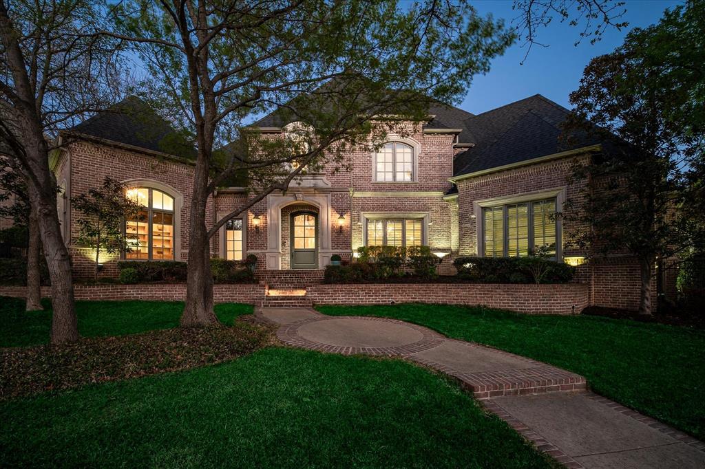 Fall in love with this beautifully updated Scott Simmons home, nestled among mature trees and designed for refined living and effortless entertaining. Elegant details include designer wallpapers, bespoke fixtures, hardwood floors, rich painted cabinetry, and quartz countertops throughout. A private study, formal living and dining, and an expansive family room flow seamlessly through a wide foyer and a generous butler’s pantry, complemented by a stylish powder bath. The two story kitchen is filled with natural light from a striking wall of windows and features a large island perfect for gathering. Enjoy year round outdoor living on the covered patio with fireplace, overlooking the remodeled Claffey pool and spa (2025) with new equipment, PebbleSheen plaster, Oklahoma flagstone coping, updated tile and lighting, wireless Aqualink controls, and a bocce court.
The first floor primary suite offers a serene retreat with the convenience of a washer and dryer in the spacious closet. A private guest suite and updated laundry room complete the main level. Upstairs includes a game room with wet bar and built in undercounter fridge, plus three unique bedrooms enhanced by Fabrica New Zealand wool carpet and fresh paint. Major improvements include updated electrical to the driveway gate (2025), refinished wood floors and updated appliances (2024), AC compressor pump and coils (2023), landscape enhancements (2023), Tesla charger, Class IV impact resistant roof and gutters (2021), quartz counters throughout, two 50 gallon water heaters (2021), and remodeled upstairs baths (2020). Custom fit rug in formal living may remain. Southlake residents enjoy award winning Carroll ISD schools, exceptional parks and trails, upscale dining and shopping, a strong sense of community, and unbeatable proximity to DFW Airport.  Care has been taken to provide accurate information, but buyer and buyer’s agent should verify all details including measurements, taxes, and schools.