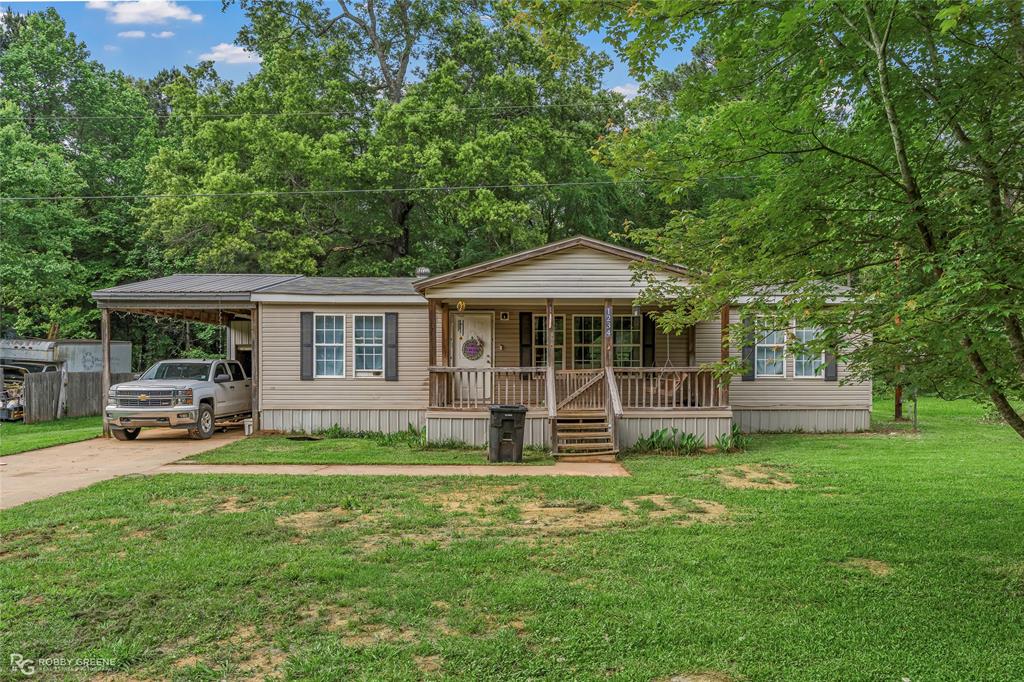 Welcome to this charming home in the highly desirable town of Haughton—perfectly located just minutes from I-20, local shopping, top-rated Haughton schools, and Barksdale Air Force Base. This 3-bedroom, 2-bath property sits on approximately one-third of an acre and offers the perfect blend of comfort and rustic charm. Step inside to an inviting open floor plan designed for both everyday living and entertaining. The spacious primary suite features a relaxing garden tub, creating the perfect retreat at the end of the day. Outside, you’ll love the large front porch, ideal for morning coffee, as well as the covered back patio overlooking a private backyard—perfect for gatherings or quiet evenings. A covered carport adds extra convenience.
If you’re looking for a move-in ready home with character, space, and a prime location, this one checks all the boxes!