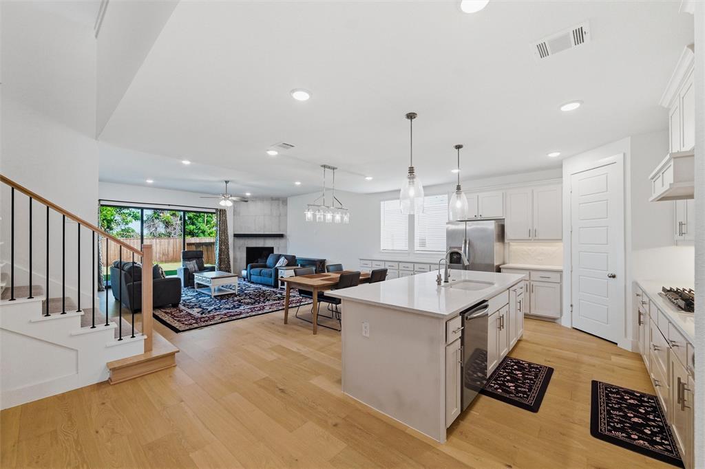 Are your buyers concerned about today’s higher interest rates? They can lock in a lower rate and reduce their monthly payments for the first two years—creating significant savings upfront. If refinanced within 2 years the leftover savings are applied to the balance. This stunning Modern Farmhouse offers exceptional curb appeal with its clean, contemporary elevation and timeless architectural design. Ideally situated on a quiet street with no neighbors directly in front or behind, the home provides both privacy and a peaceful setting. The thoughtfully designed layout includes a dedicated office, along with the primary suite and a secondary bedroom conveniently located on the first floor—offering excellent flexibility for guests, multigenerational living, or work-from-home needs. Upstairs, you’ll find two additional bedrooms and a spacious game room, adding even more versatile living space. Inside, rich hardwood flooring extends throughout the first-floor living areas and office, creating a warm yet refined atmosphere. The kitchen truly serves as the heart of the home, featuring high-end quartz countertops, beautifully painted cabinetry, a gas cooktop, and a well-designed layout ideal for both everyday living and effortless entertaining. The open-concept floor plan seamlessly connects the kitchen, dining, and living areas, allowing natural light to flow throughout and creating a bright, inviting environment. A 12-foot sliding glass door opens to a generous covered patio, perfectly blending indoor and outdoor living. The backyard extends your entertaining space, making it ideal for gatherings, relaxation, and year-round enjoyment. This thoughtfully designed home combines modern comfort with timeless appeal in a peaceful setting—while still being just minutes from AT&T Stadium, Arlington’s Entertainment District, DFW Airport, and the University of Texas at Arlington.