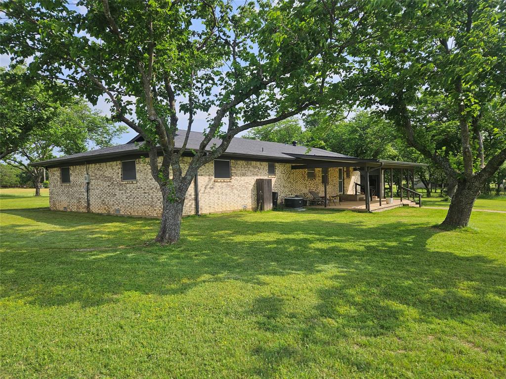 Discover the potential of this 5.7 acre property located outside city limits offering privacy, space, and versatility. The land is cleared and currently ag exempt for hay production, featuring cross fencing, a fully fenced perimeter, and a gated entrance for added security. A tank or pond adds to the property’s charm and functionality for livestock or recreational use, previous owners raised cows on the back pasture. The property includes a barn and lateral lines already in place, making it well suited for agricultural or homestead living. The home offers solid bones with a new roof installed in 2024, a lifetime transferable foundation, and an HVAC system in excellent working condition that has been regularly serviced. An oversized garage provides great flexibility and could easily be converted into a bedroom suite, workshop, or additional living space. While the interior of the home is ready for updates, this property presents a great opportunity to customize and add value in a peaceful country setting with room to grow. Buyer or buyer’s agent to verify all property details, exemptions, and measurements.