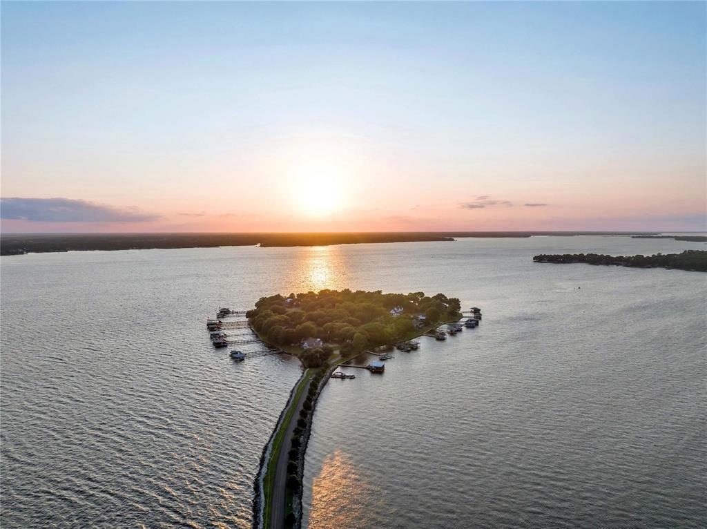 Dreaming of island life without the waterfront price tag? Welcome to 108 Enchanted Isles Circle — a rare interior lot in one of Cedar Creek Lake’s most prestigious gated communities: Enchanted Isles. Nestled on the larger of three private islands, this 0.23-acre homesite (approx. 10,018 sq ft) sits on a peaceful cul-de-sac, shaded by mature trees and surrounded by luxurious multi-million dollar homes.

Located on the east side of Cedar Creek Lake, this exclusive neighborhood offers the best of Texas lake living with two private deep-water boat launches, fishing piers, and miles of scenic causeways for biking, walking, or golf cart cruising. Build your dream retreat with confidence — the community requires site-built homes of 2,500+ sq ft, ensuring quality, consistency, and long-term value.

This lot is ideal for retirees, second-home buyers, nature lovers, and anyone seeking a peaceful, upscale lake lifestyle just over an hour from Dallas. Whether you're looking for a full-time residence or a weekend getaway, this vacant land in Mabank, TX is your chance to enjoy lake access without the premium waterfront price.

Gated island community
Close to boat ramps, fishing piers & lake views
Interior cul-de-sac lot with mature trees
Luxury neighborhood with architectural standards
Priced below market — motivated seller!

Build now or hold as an investment. Opportunities like this in Enchanted Isles on Cedar Creek Lake are few and far between — schedule your visit today!
