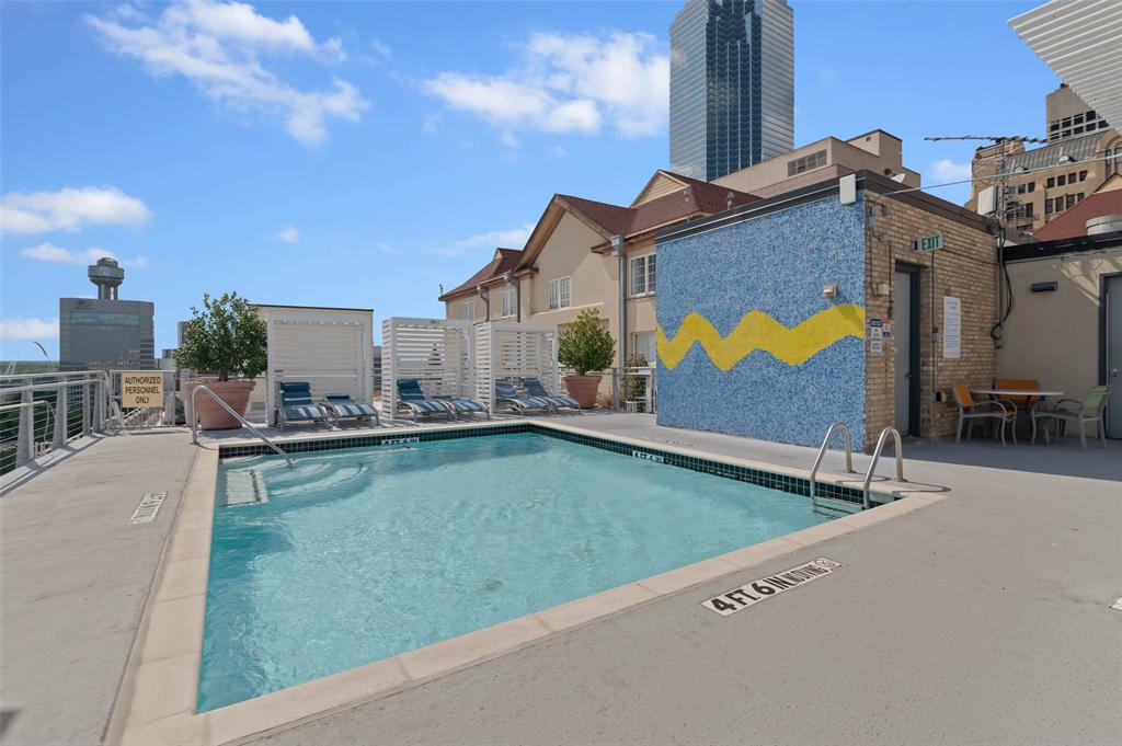MOTIVATED SELLER! Discover this stylish and move-in-ready 1-bedroom, 1-bathroom condo, perfectly situated in the vibrant heart of Downtown Dallas. Spanning a generous 1,420 square feet, this bright and open residence offers a sophisticated urban retreat with soaring ceilings, striking exposed brick walls, and floor-to-ceiling windows that frame breathtaking panoramic views of the iconic Reunion Tower and the sleek Omni Hotel. As you step inside, the expansive living area invites you to relax in a cozy seating space while enjoying ever-changing views of the glittering Dallas skyline right from your living room. A distinctive room divider adds both architectural interest and versatility, easily transforming the space into a personal workout zone, home office, or additional sleeping area as needed. Residents enjoy exceptional building amenities, including 24-hour security, a sparkling rooftop pool on the 11th floor with an inviting outdoor seating area and grill, and a fully equipped gym located on the second floor. Two separate parking spaces are included with the unit. Once yours, you can request tandem parking if desired. This prime location places you within easy walking distance of the AT&T Discovery District and The Exchange, offering effortless access to world-class dining, entertainment, shopping, and cultural attractions. The HOA fee even covers high-speed internet, water, trash, and sewer services for added convenience. Ready to experience downtown Dallas living at its best? This beautiful condo is waiting for you.