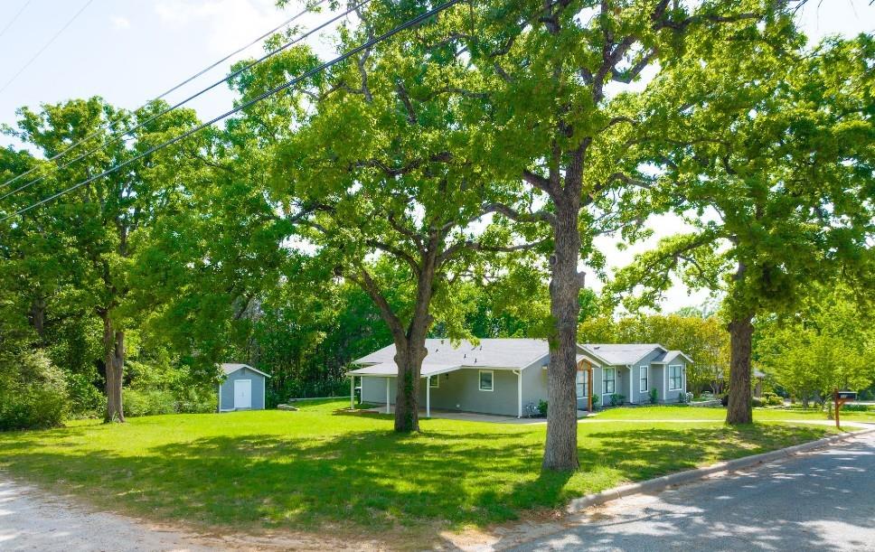 In-Town Space You Can Actually Live In — Nearly Half an Acre in Denison

Space like this is getting harder to find—especially this close to everything.

Set across three platted lots in Denison’s Sunny Side Addition, this property offers something most buyers don’t expect in town: nearly half an acre, mature oak trees, and no immediate rear neighbors—creating a sense of privacy that feels more like country living.

Inside, the home has been thoughtfully updated with fresh finishes, durable flooring, and a layout designed for real-life flexibility. The main living spaces are filled with natural light, while the oversized primary suite stands out as one of the most versatile rooms in this price range—large enough for multiple sitting areas, work-from-home space, or a true retreat feel.

The kitchen features granite countertops, ample cabinetry, and easy flow into both dining and living areas. Just off the main space, the sunroom offers a bright, inviting spot for morning coffee or a quiet end to the day—overlooking a backyard that feels expansive and full of possibility.

Outside, the value really opens up. With multiple lots, mature shade trees, and open greenspace behind, you have room to create what you need—whether that’s a workshop, garden, additional parking, or simply space to enjoy.

Located just minutes from Downtown Denison, Hwy 75, and Lake Texoma, this home offers a rare combination of space, updates, and location.

More land. Bigger rooms. More possibilities.
Isn't it time to Come Home Where You Belong?