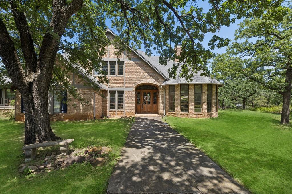 Welcome to 3343 Creek Road, a rare opportunity to own a distinctive estate on nearly two acres in Keller. Surrounded by mature trees, this property offers a peaceful setting while remaining close to shopping, dining, business centers, and major routes serving Keller, Southlake, and Colleyville. Opportunities to find this amount of land in such a central location have become increasingly limited. The residence offers approximately 4,715 square feet with 4 bedrooms and 5 bathrooms. Each bedroom features its own full bathroom, creating convenience and flexibility throughout the home. The primary suite includes separate bathrooms, while additional living spaces include a sitting room, library, and office. Three interior fireplaces add warmth and character to multiple gathering areas. Extensive built-ins and generous storage contribute to everyday functionality. Large windows capture views of trees and outdoor amenities, helping connect indoor and outdoor living. The exterior environment is a standout feature. A private inground pool creates a retreat, while five separate patio and deck areas provide options for entertaining, dining, relaxing, or enjoying the natural surroundings. A substantial outdoor fireplace serves as a focal point for gatherings and extends the enjoyment of the outdoor living spaces. The seller especially appreciates the feeling of being in the country while still enjoying the conveniences of city living. The nearly two-acre setting, mature trees, and exceptional privacy create a unique atmosphere that is difficult to replicate. Additional advantages include no HOA, no MUD, and no PID. Located within Keller ISD, this property combines space, privacy, and accessibility in a way that is increasingly rare. Property is being sold as-is. If you are searching for a Keller estate with acreage, mature trees, a private pool, multiple outdoor living areas, and a highly desirable location, 3343 Creek Road deserves your attention.