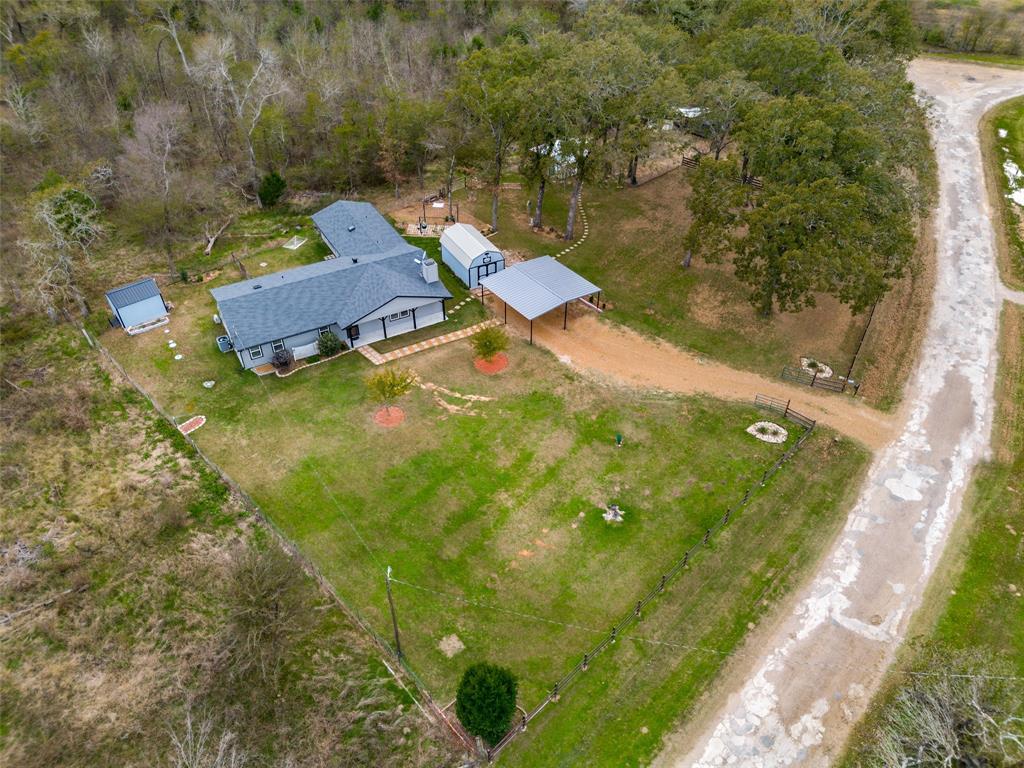 Unrestricted heavily treed 1.06 acre lot. A perfect place to call home with all Low E windows, New Farmhouse style front door, landscaping, and over-sized front porch. Int. offers Large Main Living area with corner FP, double ceiling fans, plus additional Living with access to back
porch. Kitchen showcases beautifully painted cabinets accented with SS appliances, hardware, granite, subway tile, Can
Lights, Barn Door, and large eating area. Other features include distressed laminate, ceramic tile, carpet, 2 panel doors
with levers, new patio doors, HVAC system less than 5 years old, 2 Barn Doors, Large Closets, ceiling fans, new vanities and blinds.