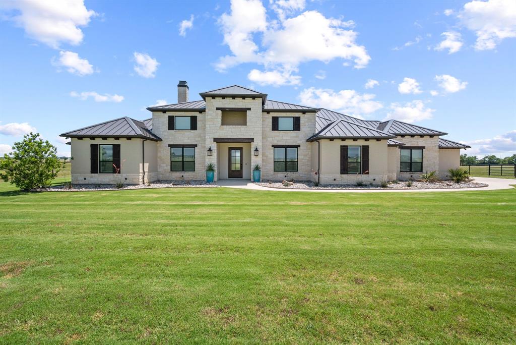 COOLEST EQUINE NEIGHBORHOOD IN ALL OF TARRANT COUNTY. Ride your horses along the extensive horse trails in your own backyard. Amazing custom built home! Beautifully designed open concept. No cost spared to make the home flow, work, look & feel magnificent. Massive kitchen with oversized granite island & commercial grade appliances. Exceptional for entertainment. Separate walk-through bar with specialty refrigerator & ice maker. INCREDIBLE MASTER BEDROOM SUITE! Huge ensuite bathroom with oversized shower & deep soaker tub. Wake up to the smell of fresh brewed coffee with a convenient coffee bay right in the bathroom. And then there is a fabulous MASTER CLOSET with a vanity station with a sink inside closet. Just get ready and close the door. Closet also has a direct access to the utility. JUST INCREDIBLE. Gets better ! Home boasts of a Safe Room & Indoor storm shelter. Oversized 3-car garage w-epoxy floor. Massive covered outdoor living space. Sparkling modern pool with all pool equipment, outdoor lights, property gate, garage + more all having control access via remote and-or phone app. Almost 20 acres of open pasture, native grass & 4-stall barn. Let's not forget the 4-hole putting green. Its an amazing place to live and entertain.  Community offers 7+ miles of equestrian trails around Benbrook lake & appx 100 acres of common area. Away from the city but centrally located. >15 mi to downtown FTW, & 30 mi. to Granbury & Weatherford. between Hwy 377 & Chisholm Trail Pkwy. Buyer & Buyer Agent to verify all information herein.
