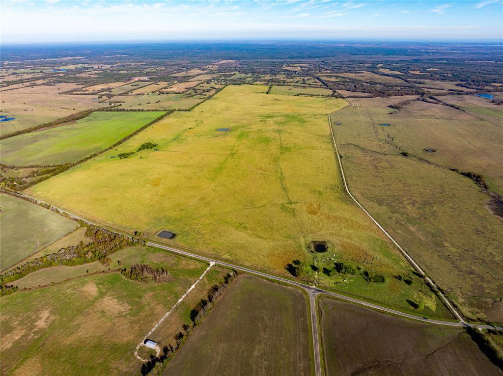 +- 598 acre cattle ranch located 7 miles northeast of Clarksville on FM 114.  This ranch includes perimeter fencing, native grasses and 5 ponds for livestock water. County water available on FM 114.  With over 2 miles of FM & county road frontage, this ranch is perfectly positioned for multiple future uses, from a single estate to divided tracts. New perimeter fencing with hand hewn  Bois d'arc arches and entrances that will easily accommodate trucks for shipping.  Whether you're dreaming of building your legacy or crafting a diverse investment, this land is primed to bring your vision to life.