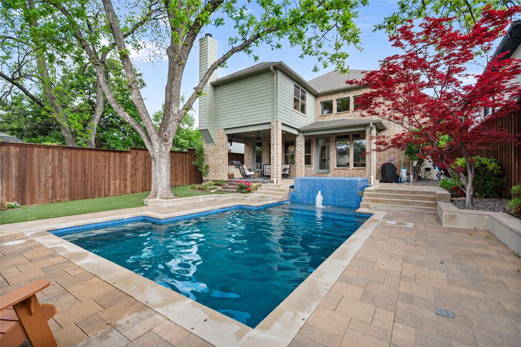 Custom Home with Resort-Style Pool Across from Tietze Park. This exceptional custom home is defined by its private, resort-style backyard—featuring a heated pool and spa, outdoor fireplace, built-in grill, and covered patio with a 70” TV—creating an unmatched setting for entertaining and everyday living. Located directly across from Tietze Park in the heart of Lakewood Heights, this 4-bedroom, 3.5-bath home offers the perfect blend of luxury, space, and walkable lifestyle just steps from Lower Greenville. Inside, the home is thoughtfully designed with three spacious living areas, a private office, hand-scraped hardwood floors, plantation shutters, custom finishes, and whole-home surround sound. Built for entertaining, enjoy a climate-controlled wine cellar, two wet bars, a dedicated media room with a 100” screen, and a game room complete with pool table and arcade games. A rare opportunity to own a true lifestyle property in one of Dallas’ most desirable neighborhoods.