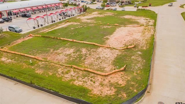 Take advantage of this outstanding commercial development opportunity in one of Lindale's most active business corridors. Located just off the highly traveled intersection of Interstate 20 and U.S. Highway 69, this property offers exceptional visibility, accessibility, and exposure to thousands of vehicles each day. Surrounded by well established national and regional restaurant brands, the site benefits from strong consumer traffic and a thriving commercial environment. With street frontage and access on two sides, the property provides excellent flexibility for site planning and customer convenience. Whether you're planning a retail development, quick-service restaurant, professional office, service business, or another commercial venture, this location offers the visibility and accessibility needed for long-term success.