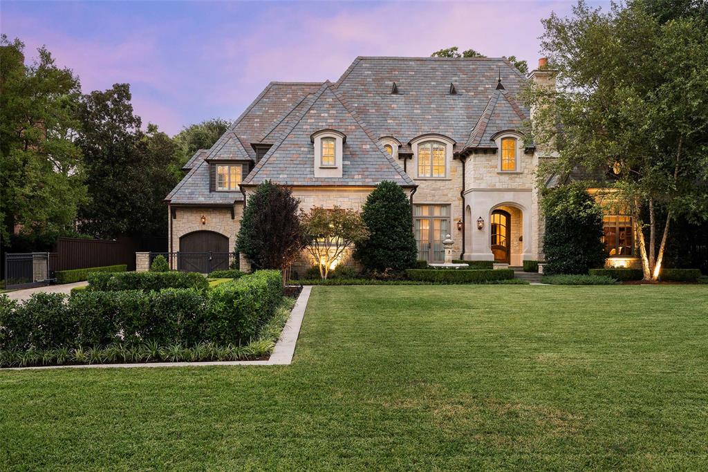 Elegant French-inspired custom home built by Allen Nixon with stone exterior, slate roof, copper gutters. Features 4 or 5 ensuite bedrooms, library, kitchen with high-end appliances, leathered marble counters, granite island with sink, butler's pantry, 2 wet bars, 7-seat theater, 2 ofc, LR, DR, upstairs living area, primary suite down, 2nd primary suite up, gleaming pool & spa, screened porch with electric screens & outdoor kitchen, 3-car garage.