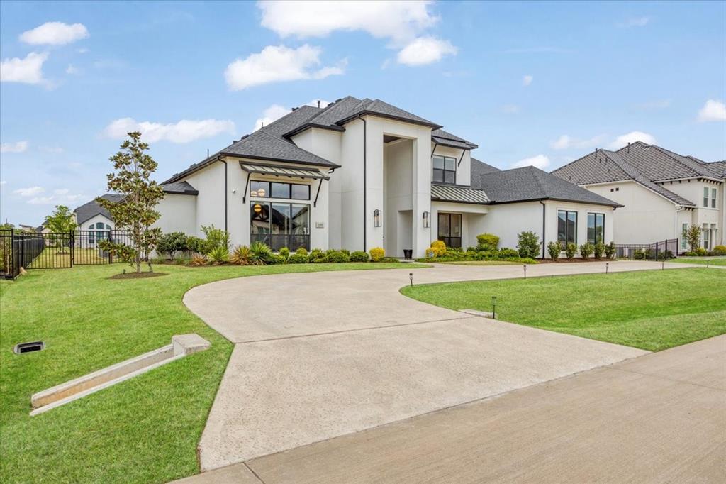 Do not miss a great opportunity to own this exquisite Toll Brothers home, built on over 50 years of award-winning craftsmanship and ideally situated in the highly sought-after Town Lakes community.

This exceptional two-story residence seamlessly blends modern transitional design with refined elegance, offering 4 spacious bedrooms, 4.5 bathrooms, expansive living areas, a game room, dedicated fitness room, a private office with custom built-in cabinetry-book shelves, an additional office nook, a 3-car garage with custom cabinetry designed for both style and functionality.
Upon entry, you are welcomed by a grand foyer highlighted by a dramatic double staircase, setting the tone for the upscale design carried throughout the home. At the heart of the residence lies a chef-inspired kitchen, beautifully appointed with an oversized waterfall island, abundant custom cabinetry, and generous prep space perfect for both everyday living and entertaining.

Thoughtfully curated details can be found throughout, including exposed cedar beams, designer lighting, electric shades, rich hardwood flooring, and an abundance of natural light. The inviting living area is anchored by a sleek linear gas fireplace, creating a warm yet refined atmosphere.
Each bedroom is designed with comfort and privacy in mind, complete with en-suite bathrooms and spacious walk-in closets.

This is more than a home—it’s a statement of refined living. Schedule your private showing today and experience it for yourself.