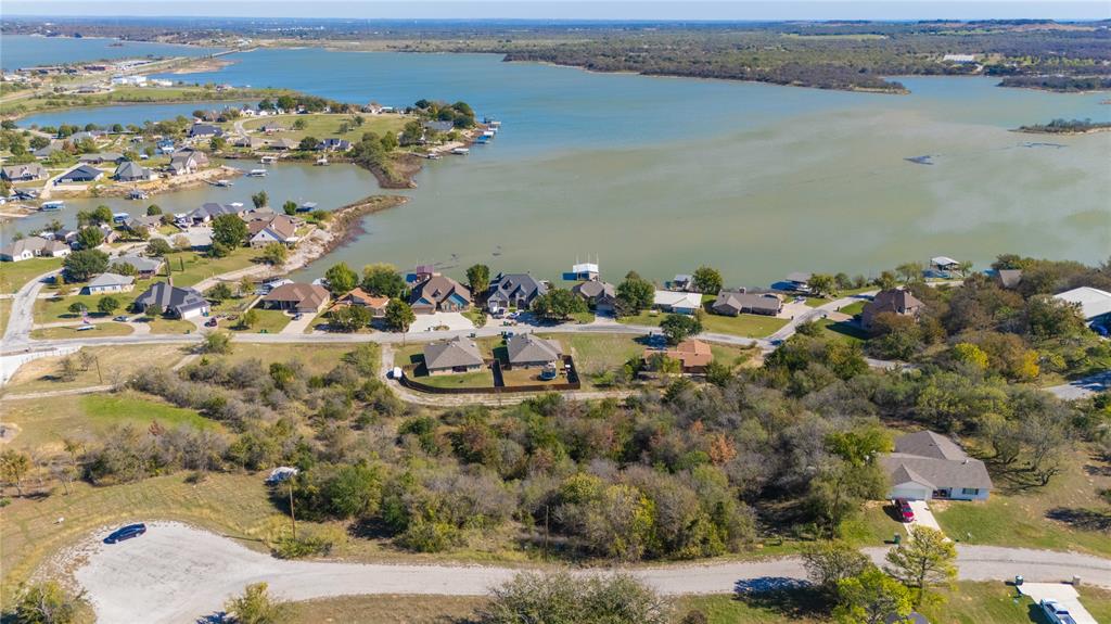 Discover the perfect spot to build your dream home or getaway retreat on this beautiful Lakeview lot in Runaway Bay. This vacant lot offers stunning lake views and easy access to an array of outdoor adventures. Located near the shores of scenic Lake Bridgeport, the property invites you to enjoy prime fishing, boating, and watersports just moments from your door. This vacant lot is ideal for those seeking both tranquility and active living. Don’t miss your chance to own a piece of paradise! SURVEY available. 3 other lots are available for sale.